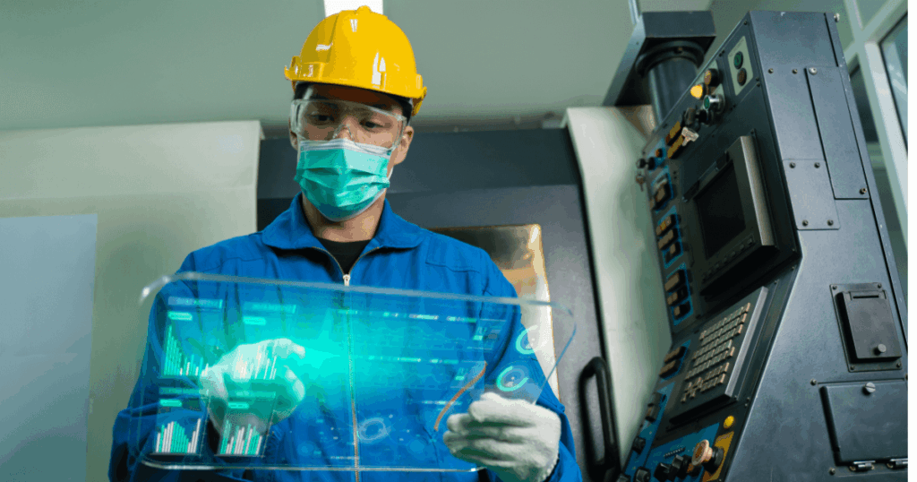 Técnico operando painel industrial com interface virtual, demonstrando o uso de digital twins na visualização de dados e controle em tempo real.